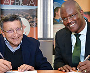 Dr. Bernie Fanaroff, project director of SKA SA, and Ndwakhulu Mukhuhi, CEO of NMISA, signing the memorandum of understanding between the organisations.